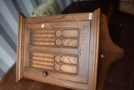An Ercol wall corner cupboard , in mid stain, possibly Colonial style