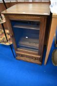 A modern dark Ercol hifi cabinet