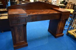 A 19th Century Regency design mahogany sideboard of twin pedestal form