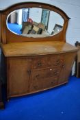 An early 20th Century golden oak mirror back sideboard