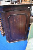 A 19th Century oak and mahogany corner cupboard