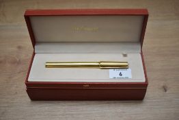 A boxed S T Dupont Montparnasse converter fountain pen gold plated reeded design having 18k Dupont