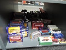 A shelf of 1970's and later Corgi die-cast Buses including 471 Silver Jubilee, Corgitronics, Origina