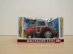 A Britains model, 9522 MF Massey Ferguson 595 Tractor, in original window display box with card
