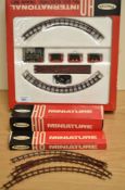 A Playcraft HO International P1600 Miniature Train Set, track length 4' 5', appears complete and