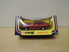 A 1970's Corgi die-cast, 319 Jaguar XJS in metallic red, in original window display box with inner