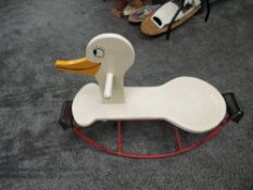 A vintage Child's Rocking Swan having wooden seat, head and handle with metal frame with