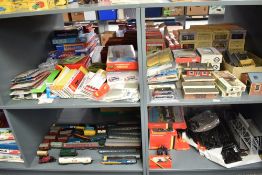 Four shelves of 00 gauge including one shelf of Rolling Stock including Hornby, Tri-ang and similar,