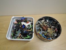 Two tin boxes of Britains and similar plastic Wild West, Military and similar figures, most on metal