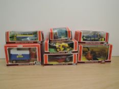 Seven 1980's Britains Farm Implements, 9542 Forage Harvester, 9548 Crop Sprayer, 9557 Bale Sledge,