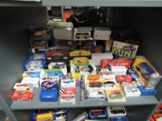 A shelf of 1970's and later Corgi die-cast Cars and Trucks, all boxed or on window display bubble
