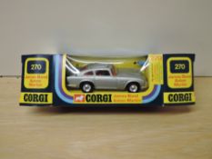 A 1970's Corgi die-cast, 270 James Bond Austin Martin, silver with red interior, bandit present,