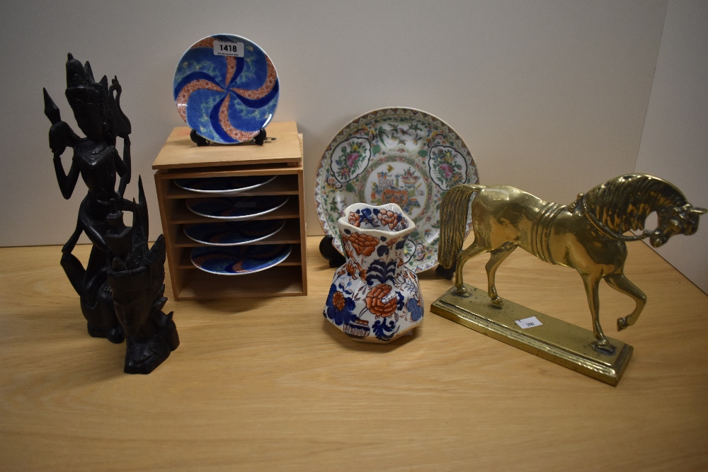 Two Balinese style hand carved figures, a set of five Meiji Imari style geometric plates, a