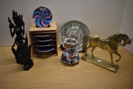 Two Balinese style hand carved figures, a set of five Meiji Imari style geometric plates, a