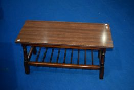 A vintage coffee table having priory style frame and formica top, approx 91 x 38cm, height 48cm