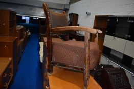 A vintage stained frame easy chair