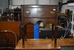 A period oak side table with drawer having Georgian brass handles, shaped apron and legs, dimensions