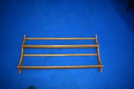 An Ercol wall delft rack, width approx. 97cm