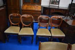 A set of four Victorian mahogany balloon back dining chairs