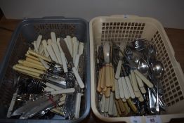 Two baskets of ivorine handled flatware