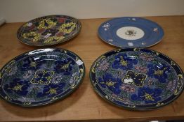 Four Royal Doulton plates, three having repeating stylised floral design and another with blue