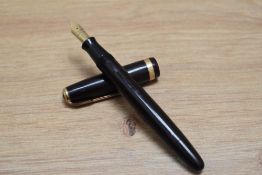 A Parker Duofold button fill fountain pen in chocolate brown with decorative band to the cap
