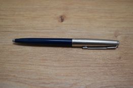 A Parker ballpoint pen in blue with stainless steel cap