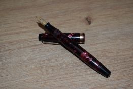 A Parker Televisor Junior button fill fountain in rose marble with single broad band to the cap