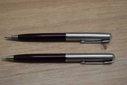 Two Parker propelling pencils in burgundy on with liquid lead cartridge