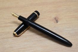 A Parker Slimfold aero fill fountain pen in black with a narrow decorative band to the cap having