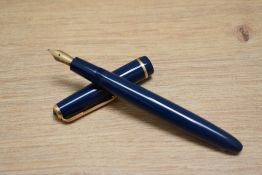 A Parker Duofold Junior aero fill fountain pen in blue with narrow decorative band to the cap having