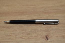A Parker 51 propelling pencil in black with lustraloy cap. engraved