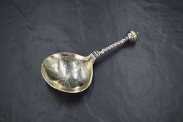 An interesting 17th/18th century Norwegian white metal spoon, the shallow gilt circular bowl
