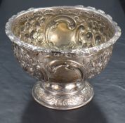 A Scottish Victorian silver bowl, of circular form with crimped slender rim over a body embossed and