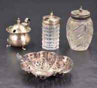 An Edwardian pierced silver dish, of shamrock or clover form pierced and embossed with repeating