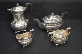 A George V silver four-piece tea set, comprising hot water pot, teapot, sugar and cream, each of