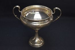 A George V silver agricultural trophy, of flattened and dished circular form with two scrolled