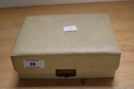 A mid-20th Century leatherette jewellery box with contents, including bead necklaces, a silver