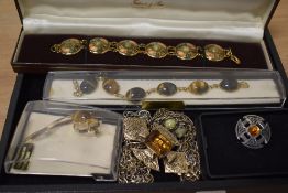 A tray of assorted Tiger's Eye design jewellery, a Celtic pewter brooch, and other jewellery
