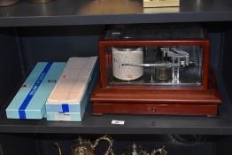 A mid-20th Century barograph, by Casella of London, in mahogany case, measuring 24cm x 38cm x