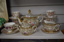 A 20th Century Mitterteich Bavarian tea service, gilt floral vines on cream ground, comprising