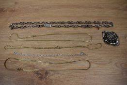 A silver necklace having moulded links with spacers and a box and tongue clasp, a silver chain, an