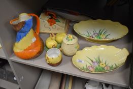 Two Carlton ware flower dishes, a 1930s Wadeheath pinch neck jug, a Clarice Cliff style chess dish