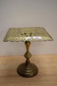 A Victorian brass fireside kettle stand, with pierced tilting top, marked '1895 Patent No.702' to