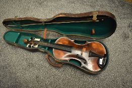 A traditional violin, havion lion headstock, printed label Antione Stradavarius, Cremona, with bow