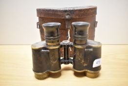 A pair of Hunsicker & Alexis, Paris MG binoculars bearing military crowsfoot mark in original