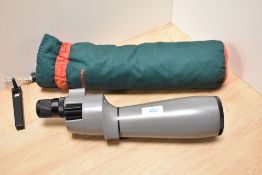 A Bushnell Spacemaster II spotting scope. Scratch to lens