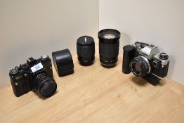 Two Cameras. An Olympus OM10 with auto winder and OM System Zuico MC Auto-S 1:1,8 50mm lens, a Zenit