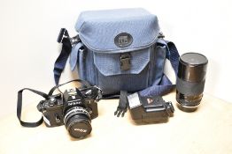 A Nikon EM camera No7148725 with Nikon Series E 1:1,8 50mm lens, a Tamron BPAR Multi C 1:3,5 200mm