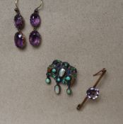 An Arts and Crafts inspired white metal brooch set with irregular pearls and turquoise beads with